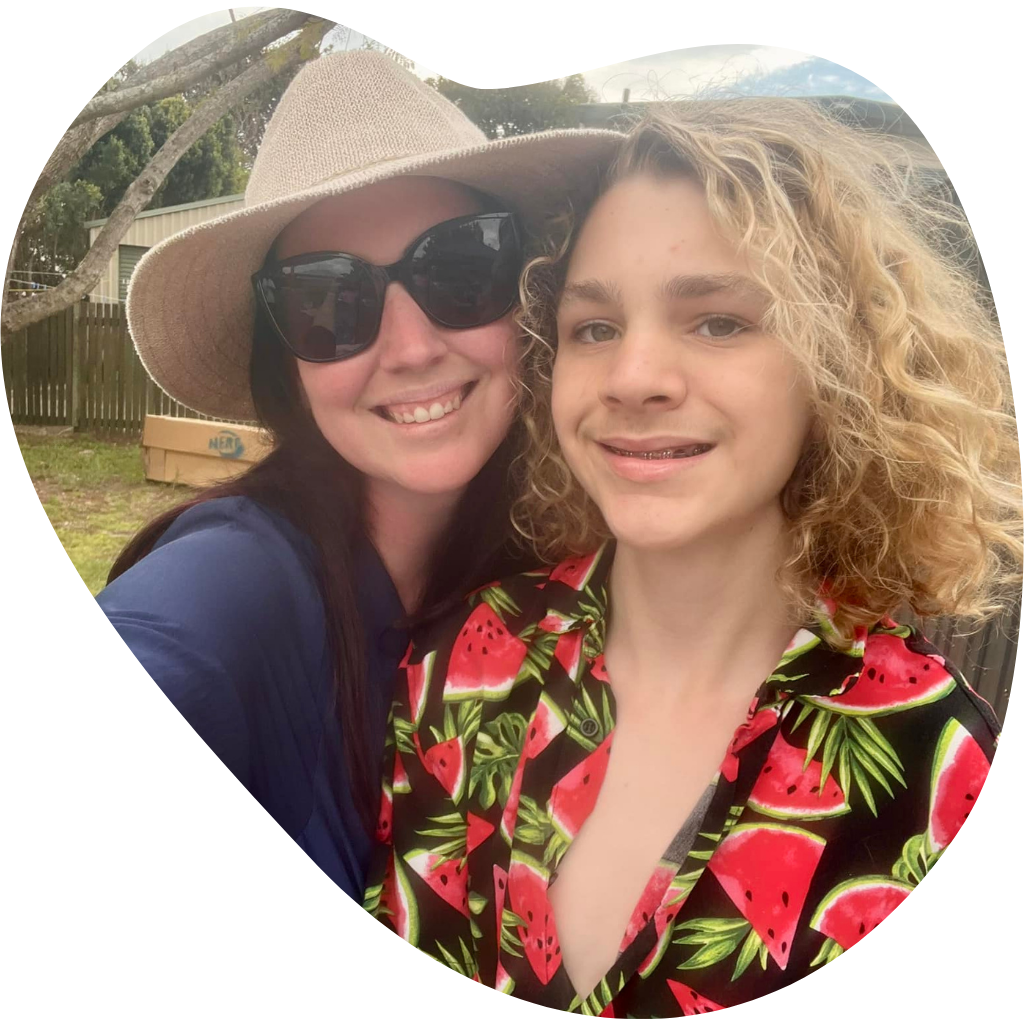 Alicia smiling outdoors with a young person, from IntoLife’s original website